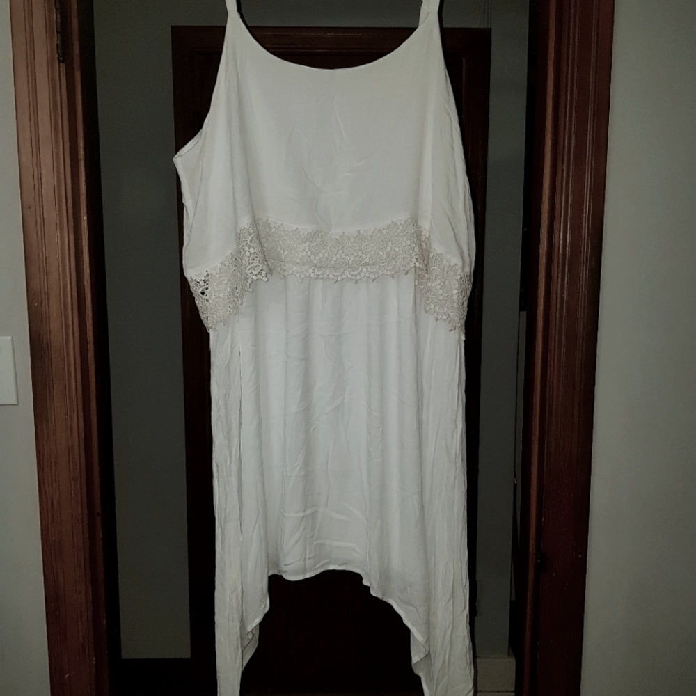 Lined white side hi low dress with crotched details.